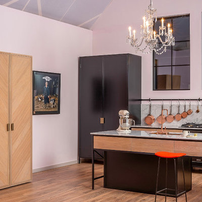 Inspiration for a contemporary galley medium tone wood floor and brown floor kitchen remodel in Dublin with an undermount sink, flat-panel cabinets, medium tone wood cabinets, gray backsplash, stone slab backsplash, an island and gray countertops