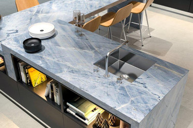 Inspiration for a modern kitchen remodel in Dallas with quartzite countertops, blue backsplash, stone slab backsplash, an island and blue countertops