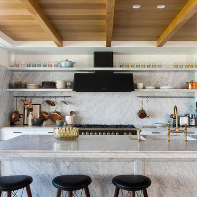 Eat-in kitchen - transitional galley eat-in kitchen idea in Sydney with an undermount sink, shaker cabinets, white cabinets, marble countertops, gray backsplash, marble backsplash, black appliances, an island and gray countertops