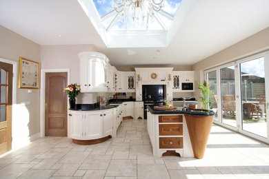 Design ideas for a contemporary l-shaped kitchen in Other with granite worktops and an island.
