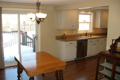 Example of a mid-sized classic galley dark wood floor kitchen design in Cleveland