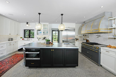 Photo of a medium sized urban u-shaped enclosed kitchen in New York with flat-panel cabinets, black cabinets, zinc worktops, an island and white worktops.