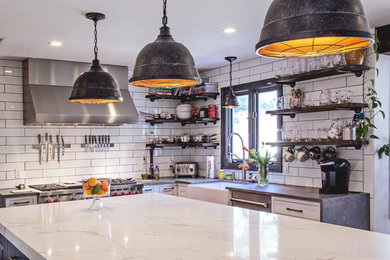 Inspiration for an industrial kitchen remodel in New York with a farmhouse sink, open cabinets, brown cabinets, concrete countertops, white backsplash, subway tile backsplash, stainless steel appliances, an island and gray countertops