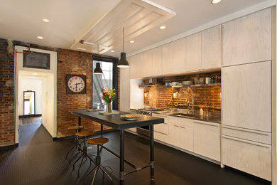 Urban single-wall kitchen photo in DC Metro with flat-panel cabinets, light wood cabinets, stainless steel countertops, an island, an integrated sink, stainless steel appliances and brown backsplash