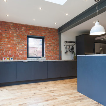 Industrial Kitchen With Exposed Brick & Stainless Steel Features