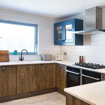 Industrial Rustic kitchen with doors made from 100 year old Reclaimed wood.