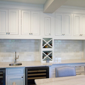 Inset White Cabinetry with Wine Racking and Glass Displays