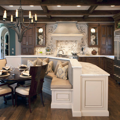 Inspiration for a large timeless l-shaped dark wood floor eat-in kitchen remodel in Atlanta with stainless steel appliances, marble countertops, raised-panel cabinets, dark wood cabinets, an island and white countertops
