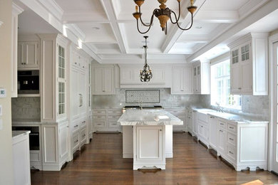 Large elegant u-shaped open concept kitchen photo in Other with a farmhouse sink, recessed-panel cabinets, white cabinets, marble countertops, multicolored backsplash, marble backsplash, stainless steel appliances and an island