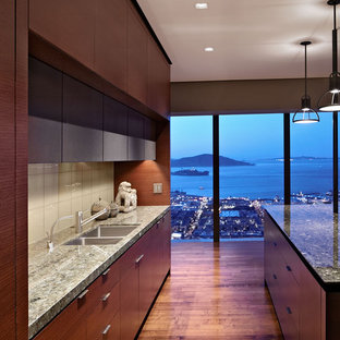 Minimalist kitchen photo in San Francisco with glass tile backsplash, a double-bowl sink, flat-panel cabinets, dark wood cabinets, white backsplash and granite countertops