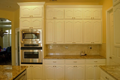 Inspiration for a timeless kitchen remodel in Sacramento with white cabinets and multicolored backsplash