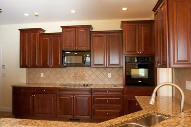 Kitchen - large kitchen idea in Other with a drop-in sink, dark wood cabinets and granite countertops