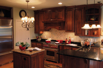 Example of a classic medium tone wood floor kitchen design in Milwaukee with a double-bowl sink, beaded inset cabinets, medium tone wood cabinets, stainless steel appliances and an island