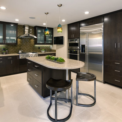 Large transitional u-shaped ceramic tile and white floor eat-in kitchen photo in Orange County with an undermount sink, flat-panel cabinets, dark wood cabinets, granite countertops, brown backsplash, subway tile backsplash, stainless steel appliances and an island
