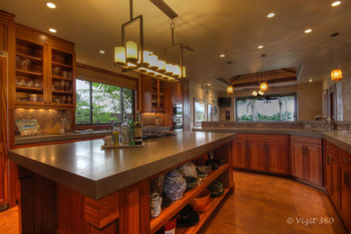 Example of a large island style eat-in kitchen design in Hawaii with a double-bowl sink, medium tone wood cabinets, quartz countertops, paneled appliances, an island and gray countertops