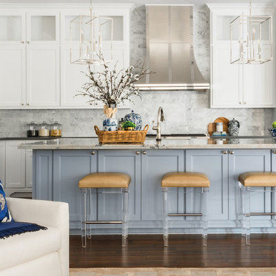 Inspiration for a large transitional l-shaped dark wood floor and brown floor open concept kitchen remodel in Houston with white cabinets, white backsplash, an island, gray countertops, an undermount sink, recessed-panel cabinets and marble backsplash