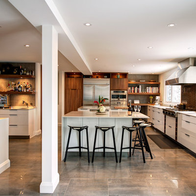 Trendy l-shaped gray floor kitchen photo in Ottawa with flat-panel cabinets, white cabinets, brown backsplash and stainless steel appliances