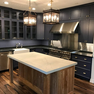 Contemporary eat-in kitchen in Other with glass-front cabinets, purple cabinets, quartz benchtops, timber splashback, stainless steel appliances, medium hardwood floors and with island.