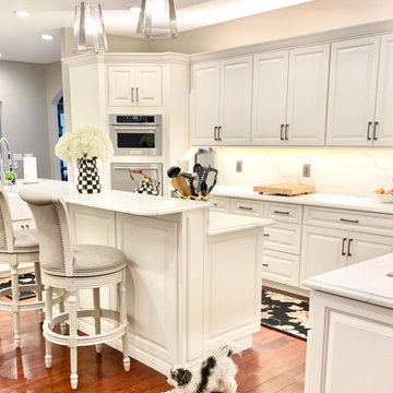 Ivory White Kitchen With Marble Look Quartz Counters and Splash