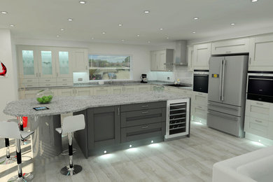This is an example of a large contemporary l-shaped kitchen/diner in Dorset with a built-in sink, shaker cabinets, grey cabinets, granite worktops, grey splashback, glass sheet splashback, stainless steel appliances, light hardwood flooring and an island.