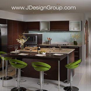 Design ideas for a mid-sized contemporary l-shaped eat-in kitchen in Miami with an undermount sink, flat-panel cabinets, dark wood cabinets, marble benchtops, white splashback, glass sheet splashback, stainless steel appliances, marble floors, with island and white floor.