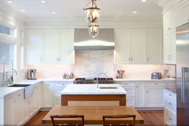Eat-in kitchen - mid-sized contemporary l-shaped dark wood floor eat-in kitchen idea in San Francisco with a farmhouse sink, recessed-panel cabinets, white cabinets, marble countertops, white backsplash, stone slab backsplash, stainless steel appliances and an island