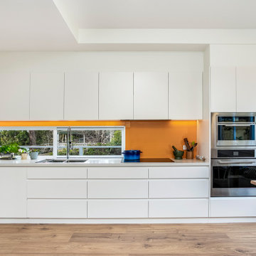 Modern Kitchen with Orange Splashback