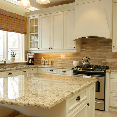 Inspiration for a mid-sized timeless u-shaped ceramic tile kitchen remodel in Toronto with granite countertops, a double-bowl sink, recessed-panel cabinets, white cabinets, brown backsplash, stainless steel appliances, stone tile backsplash and an island