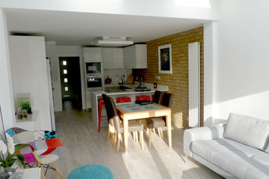 Design ideas for a small contemporary u-shaped open plan kitchen in Hertfordshire with a breakfast bar.