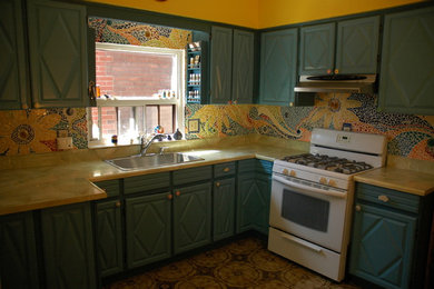 Mid-sized cottage l-shaped eat-in kitchen photo in Toronto with mosaic tile backsplash