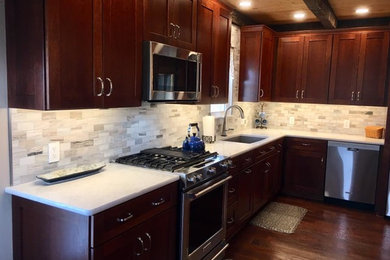 Inspiration for a mid-sized transitional l-shaped medium tone wood floor and brown floor eat-in kitchen remodel in Other with an undermount sink, open cabinets, dark wood cabinets, quartz countertops, white backsplash, ceramic backsplash, stainless steel appliances, an island and white countertops