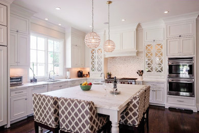 Large elegant l-shaped dark wood floor and brown floor kitchen photo in Raleigh with white cabinets, marble countertops, paneled appliances, an island, an undermount sink, beaded inset cabinets, white backsplash and mosaic tile backsplash