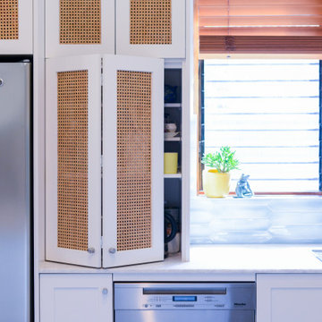 Costal kitchen with bi-fold  rattan door inserts