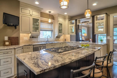 Mid-sized arts and crafts l-shaped dark wood floor eat-in kitchen photo in Kansas City with a single-bowl sink, recessed-panel cabinets, granite countertops, beige backsplash, subway tile backsplash, stainless steel appliances and an island