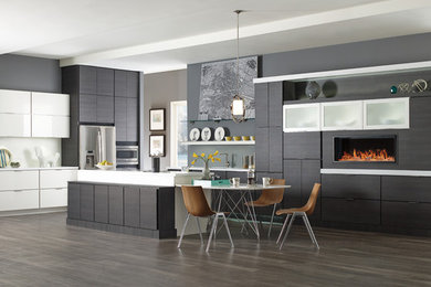 Eat-in kitchen - large modern l-shaped porcelain tile and brown floor eat-in kitchen idea in Grand Rapids with an island, flat-panel cabinets, gray cabinets, white backsplash, stainless steel appliances, an undermount sink and solid surface countertops