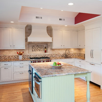 Mid-sized elegant u-shaped light wood floor and beige floor enclosed kitchen photo in DC Metro with shaker cabinets, a double-bowl sink, white cabinets, granite countertops, beige backsplash, porcelain backsplash, stainless steel appliances and an island
