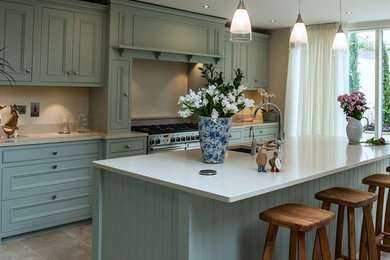 This is an example of a world-inspired kitchen in Dublin with an island.
