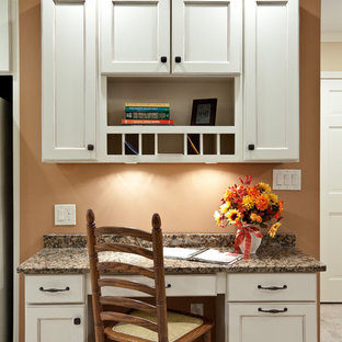Mid-sized traditional single-wall eat-in kitchen in Atlanta with recessed-panel cabinets, white cabinets, granite benchtops, porcelain floors, beige floor and brown benchtop.