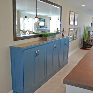 Inspiration for a large beach style u-shaped eat-in kitchen in Baltimore with shaker cabinets, with island, an undermount sink, stainless steel appliances, ceramic floors, blue cabinets and granite benchtops.