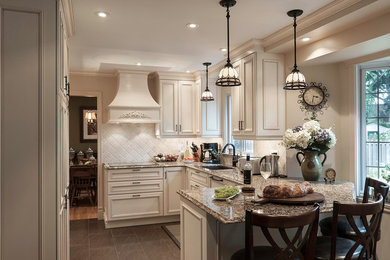 Mid-sized ornate u-shaped slate floor and gray floor eat-in kitchen photo in Montreal with a double-bowl sink, beaded inset cabinets, white cabinets, granite countertops, beige backsplash, stone tile backsplash, paneled appliances and a peninsula