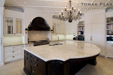 Kitchen - large traditional marble floor kitchen idea in Toronto with an island