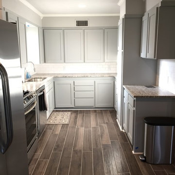 Kitchen after...note fridge moved from right wall to where exterior door was