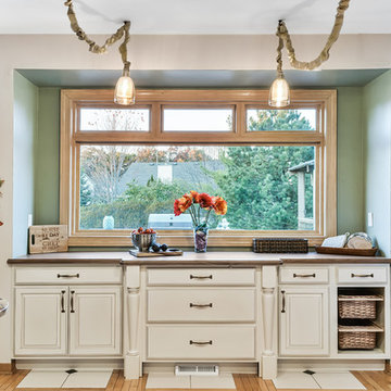 Kitchen Alcove with Painted Glazed Raised Paneled Doors and Wood Countertop