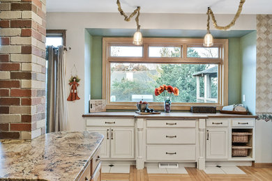 Kitchen Alcove with Painted Glazed Raised Paneled Doors and Wood Countertop