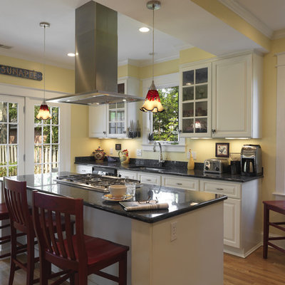 Inspiration for a timeless kitchen remodel in DC Metro with raised-panel cabinets, white cabinets and black backsplash