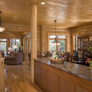 Kitchen and dining in a rustic round log home