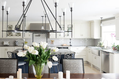 Eat-in kitchen - large transitional u-shaped ceramic tile and beige floor eat-in kitchen idea in Other with a farmhouse sink, glass-front cabinets, blue cabinets, granite countertops, gray backsplash, subway tile backsplash, stainless steel appliances, an island and brown countertops