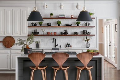 Example of a mid-sized minimalist l-shaped dark wood floor and brown floor eat-in kitchen design in Atlanta with open cabinets, dark wood cabinets, quartzite countertops, white backsplash, an island, white countertops, a drop-in sink, ceramic backsplash and stainless steel appliances