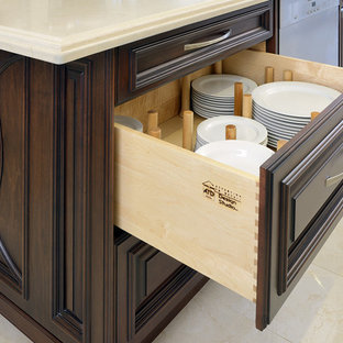 This is an example of a mid-sized traditional single-wall eat-in kitchen in Toronto with an undermount sink, raised-panel cabinets, quartz benchtops, beige splashback, panelled appliances, porcelain floors and with island.