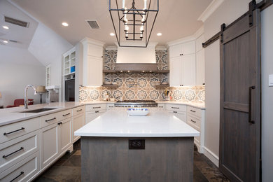 Kitchen pantry - large farmhouse u-shaped cement tile floor and vaulted ceiling kitchen pantry idea in Houston with an undermount sink, shaker cabinets, white cabinets, quartz countertops, multicolored backsplash, mosaic tile backsplash, stainless steel appliances, an island and white countertops